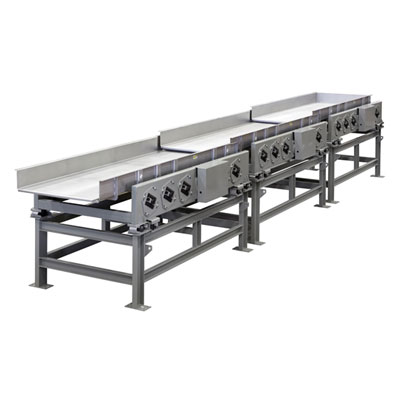 Eriez vibratory mechanical conveyor shown with multiple inline vibratory conveyors on common frame.