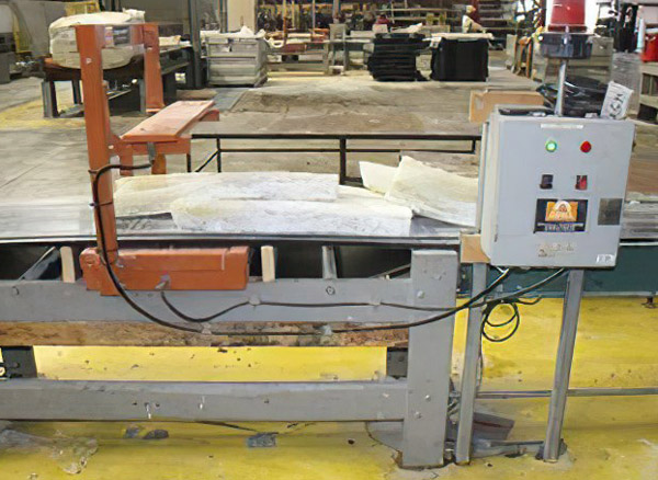 Installation of Eriez 1235 metal detector on conveyor belt. Control shown on right side.